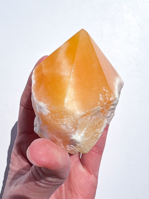 Orange Calcite half polished point