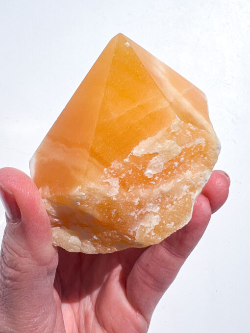 Orange Calcite half polished point