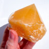 Orange Calcite half polished point