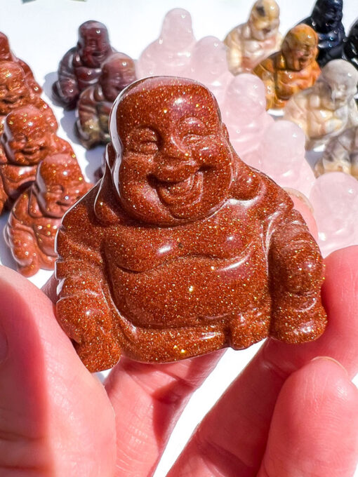 Goldstone laughing buddha carving